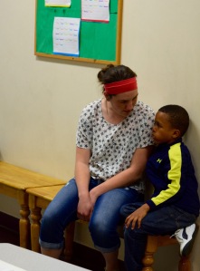 staff member with kid at vincent house